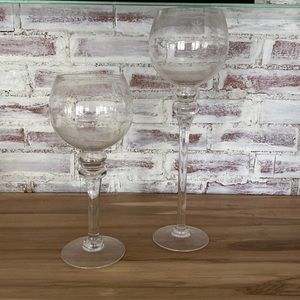 Accent pieces. Two sizes of round glass vases.